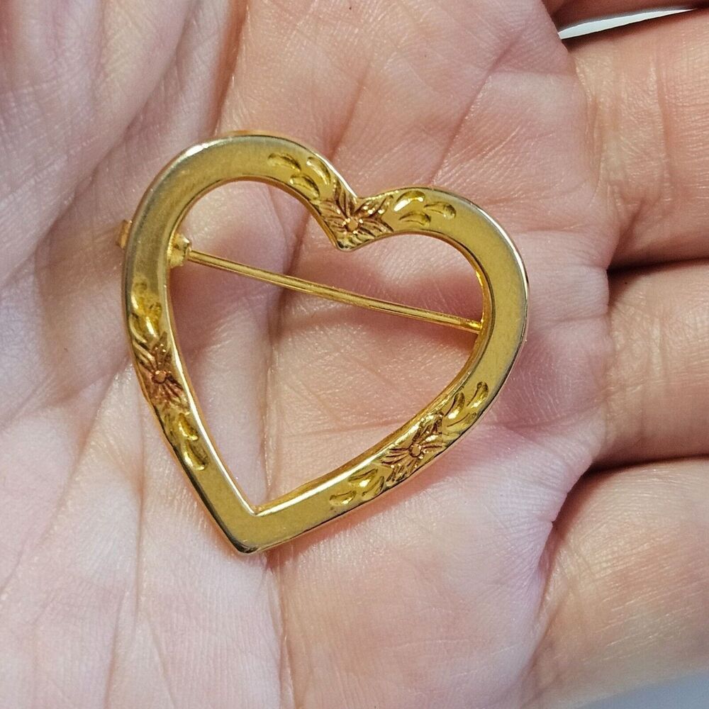 Gold tone open heart brooch